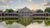 Hall of Springs A large brick building is reflected in a pond.