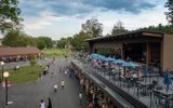A view of a large outdoor area with people walking around.