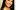 Jenheadshot_SPAC A woman in a black top smiling for the camera.